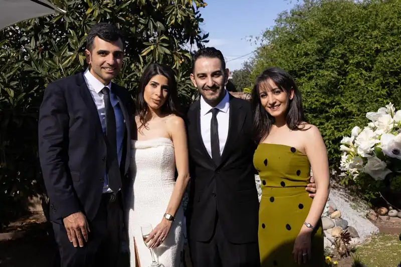 Bride and groom photographed in bright midday sun